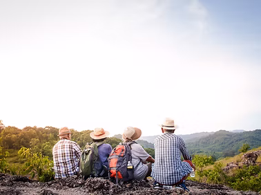 Four elderly men enjoying a mountain view