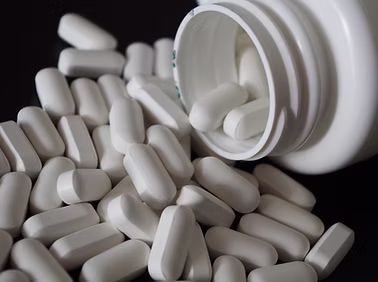 A bottle of pills spilling out of a bottle